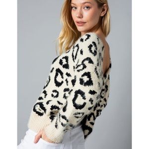 &merci off-shoulder twist back leopard sweater